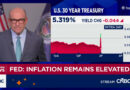 Fed approves interest rate hike, signals one more to come this year